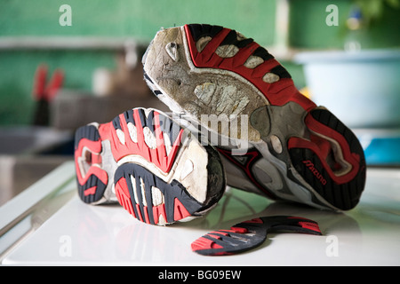 Destroyed Sport Shoes after the visit of Pacaya Volcano Guatemala Stock Photo