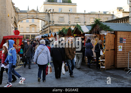 Bath Christmas market in the heart of the historic city centre Customers and stall holders Bath Somerset England UK Stock Photo