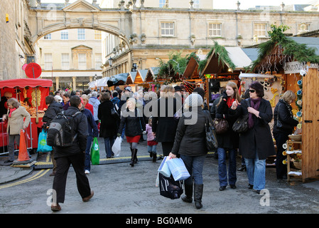Bath Christmas market in the heart of the historic city centre Customers and stall holders Bath Somerset England UK Stock Photo