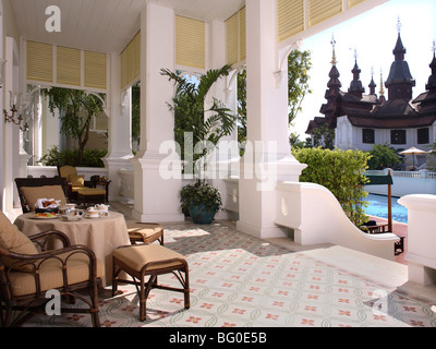 Outdoor dining on the balcony with a pool view at the Mandarin Oriental Dhara Dhevi in Chiang Mai, Thailand, Asia Stock Photo