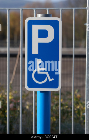 post with disabled parking sign in a car park in the uk ireland Stock Photo