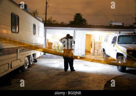 Las Vegas Metropolitan Police Crime Scene Investigator photographing a crime scene in Las Vegas, Nevada, USA Stock Photo