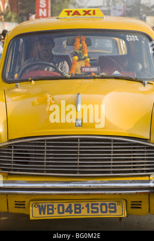 Yellow Ambassador taxi outside Howrah train station, Kolkata (Calcutta), West Bengal, India, Asia Stock Photo