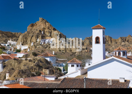 View across rooftops to cave houses in the troglodyte district, Guadix, Granada, Andalucia (Andalusia), Spain, Europe Stock Photo