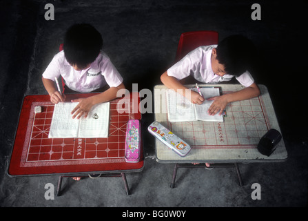 Two brothers doing schoolwork at home, Taipei, Taiwan Stock Photo