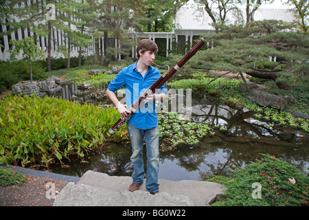 Oberlin, Ohio - Music student Wade Coufal plays his bassoon on the campus of Oberlin College. Stock Photo