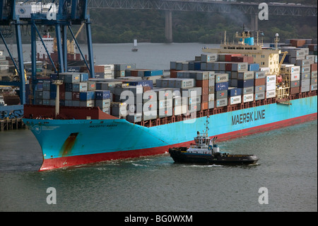 aerial view above tug boat pulling Maersk Line containership Balboa Port Panama Stock Photo