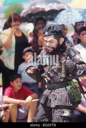 A man dressed as Che Guevara dances in the annual August festival in Santa Cruz del Quiche, Guatemala. Che is a hero to many who live in Guatemala Stock Photo