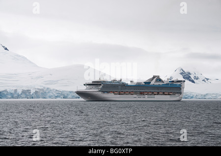 Ship sailing in the waters around the Antarctic Peninsula, Antarctica, Polar Regions Stock Photo