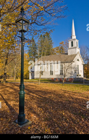 Autumn fall colours around traditional white timber clapperboard church, Grafton, Vermont, New England, USA Stock Photo