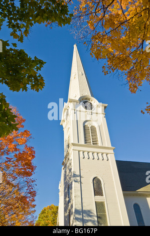 Autumn fall colours around traditional white timber clad church, Manchester, Vermont, New England, United States of America Stock Photo
