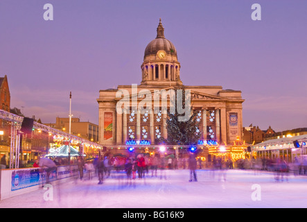 Ice skaters on Christmas outdoor ice skating rink in the Old Market Square, Nottingham, Nottinghamshire, United Kingdom Stock Photo
