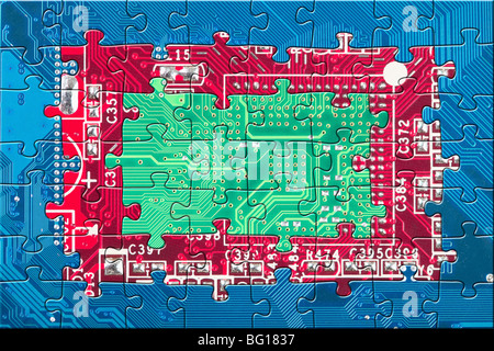 Abstract color electronic circuit board puzzle background in blue, red and green colors Stock Photo