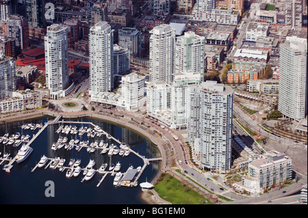 Aerial view of False Creek and Downtown City during a vibrant sunset ...