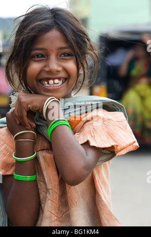 Poor lower caste indian street girl with a beautiful smile Stock Photo