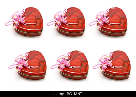 Heart shaped gift boxes aranged on white background Stock Photo