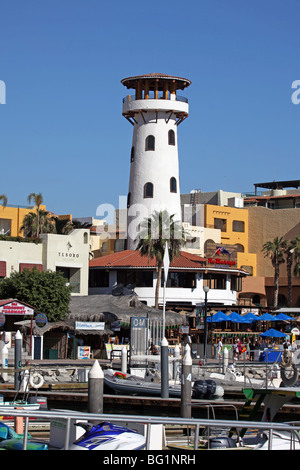 Cabo San Lucas marine harbor with boats and lighthouse. Mexican resort and cruise port on tip of the Baja peninsula. Stock Photo