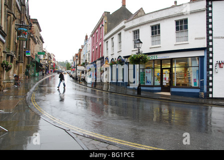 empty Glastonbury High Street in the rain Somerset England Stock Photo