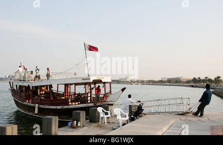 A pleasure dhow sailing from Doha Corniche for a trip around the bay Stock Photo