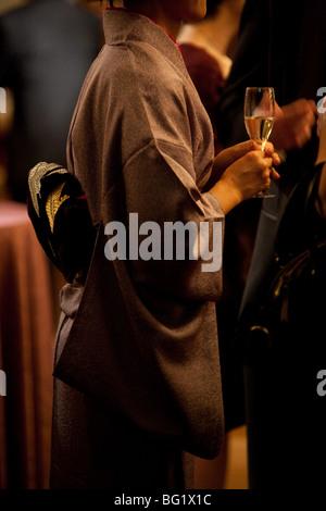 Japanese woman in kimono drinking champagne Stock Photo