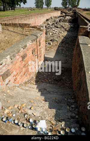Steps leading down to the demolished gas chambers at Birkenau (Auschwitz II - Birkenau) Nazi death camp in Oswiecim, Poland. Stock Photo