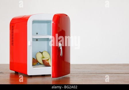 Shiny bright red miniature fridge Stock Photo