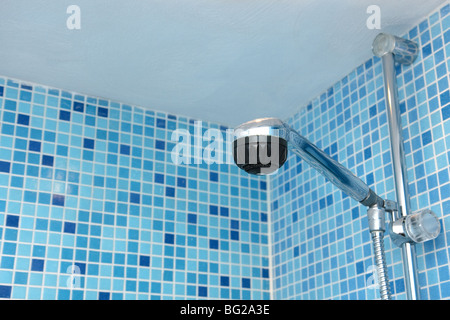 shower head in bathroom of blue mosaic tiles Stock Photo