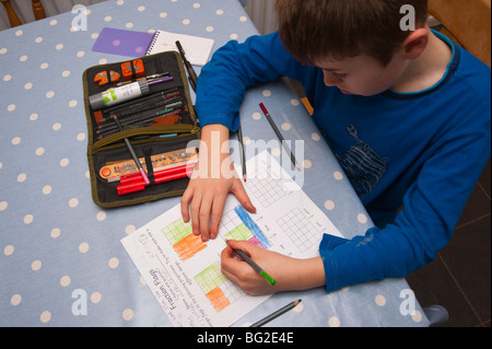 A MODEL RELEASED picture of a ten year old boy doing his maths homework in the Uk