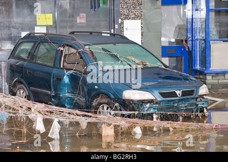 A flooded car on Cockermouth's main street after the devastating November 2009 floods. Stock Photo