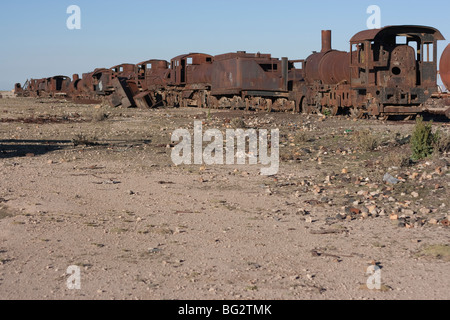 An old train sits in the train graveyard in Uyuni Bolivia Stock Photo