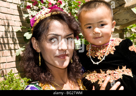 An Uighur mother with her child. Stock Photo