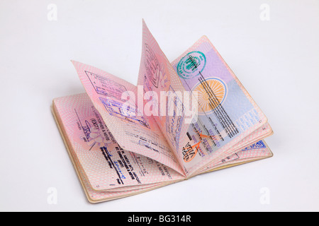 UK Passport pages with destination stamps from different countries. Stock Photo