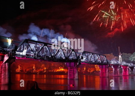 The bridge over the River Kwai illuminated for the Kanchanaburi light and sound WW11 festival with simulated allied air attack Stock Photo