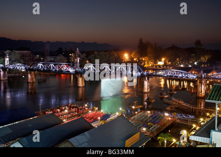 The bridge over the River Kwai illuminated for the annual Kanchanaburi light and sound WW11 festival. Thailand S. E. Asia Stock Photo