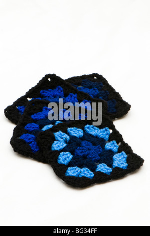 Hand crocheted black and blue multi-coloured granny squares made out of acrylic double knitting wool Stock Photo