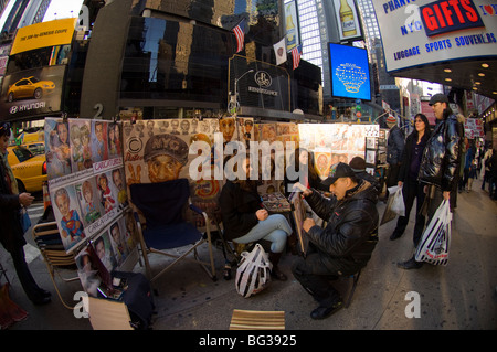 Street artists drawing customers portraits in Times Square in New York on Sunday, November 29, 2009. (© Frances M. Roberts) Stock Photo