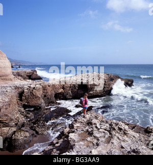 CALIFORNIA - Hiker on the Pacific Coast at Sculptured Beach in Point Reyes National Seashore. Stock Photo