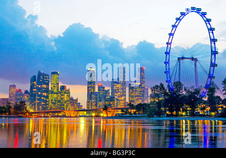 Singapore Flyer and skyline. Singapore, Singapore City, Marina Bay. Stock Photo