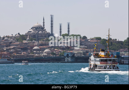 Ferry boat on Bosphorus with the Suleymaniye Mosque in the distance, Istanbul, Turkey, Europe Stock Photo