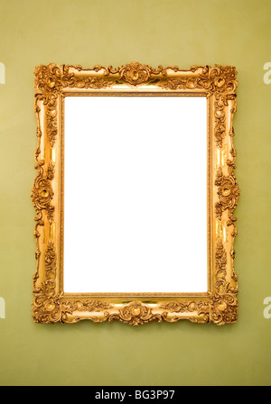 Ornate picture frame hanging on a greenish wall Stock Photo