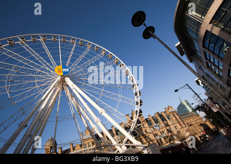 UK, England, Manchester, Cathedral Street, Manchester Wheel towering over the triangle, former corn exchange Stock Photo