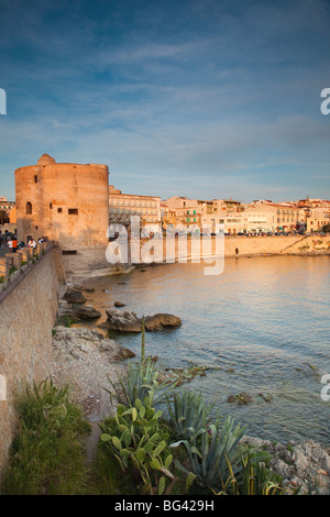 Italy, Sardinia, Western Sardinia, Alghero, city walls by Torre Sulis tower, sunset Stock Photo
