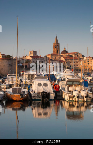 Italy, Sardinia, Western Sardinia, Alghero, city walls from the yacht marina, sunrise Stock Photo