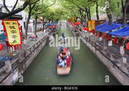 Boats taking tourists along canal, Tongli, Jiangsu, China, Asia Stock Photo