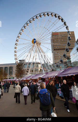 UK, England, Manchester, Cateaton Street, shoppers at Christmas Market below the Manchester Wheel Stock Photo