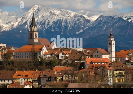 St. Cantianus Church in the foreground and the Kamnik Alps behind, Kranj, Slovenia, Europe Stock Photo