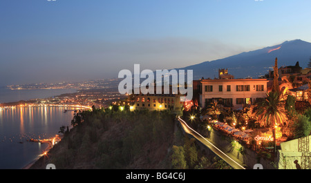 View from Taormina at dusk of coast and Mount Etna, Sicily, Italy, Europe Stock Photo