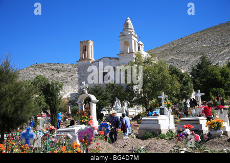 Families decorating graves for Day of the Dead, Templo de Guadalupe, Real de Catorce, San Luis Potosi state, Mexico Stock Photo