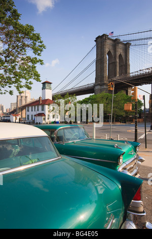 Two 1950's cars parked near the Brooklyn Bridge at Fulton Ferry Landing, Brooklyn, New York City, New York, USA Stock Photo