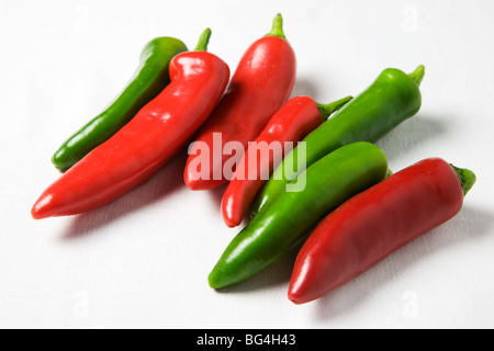 Red and Green Chili Peppers on a White Background Stock Photo